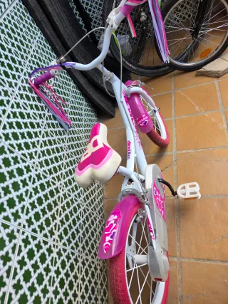 Bicicleta infantil rosa con ruedas de 12 pulgadas