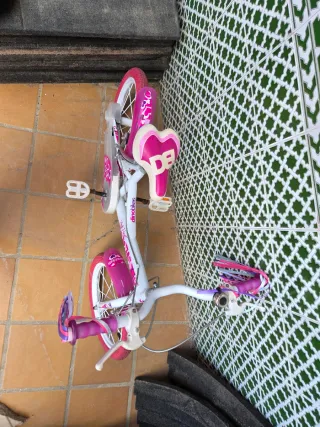 Bicicleta infantil rosa con ruedas de 12 pulgadas