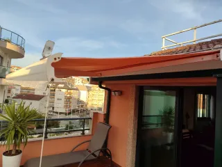 Toldo para el sol color salmón