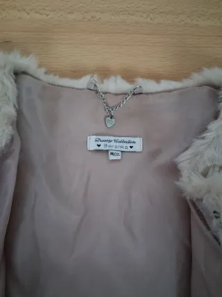 Chaleco pelo beige manga corta