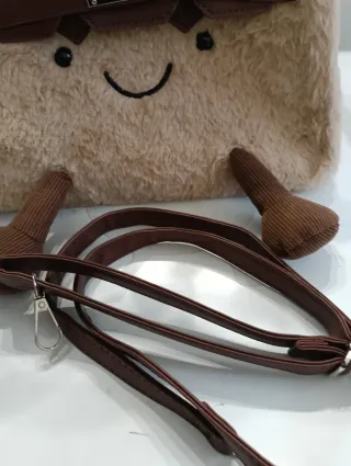 Bolso peluche con cara sonriente