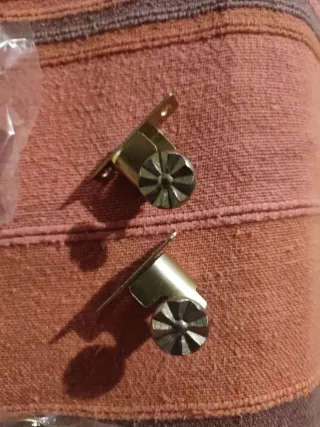 Soportes para cortinas dorados