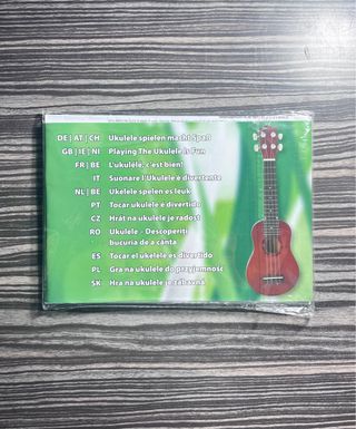 Ukelele púrpura + Manual (sin abrir)