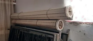 Ventanal aluminio con rejas y persianas