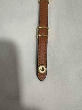 Pulsera azul con detalles dorados