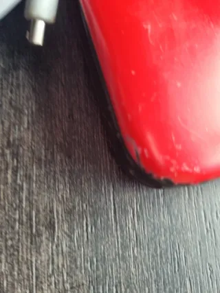 Nintendo 3DS XL Roja con su cargador original.