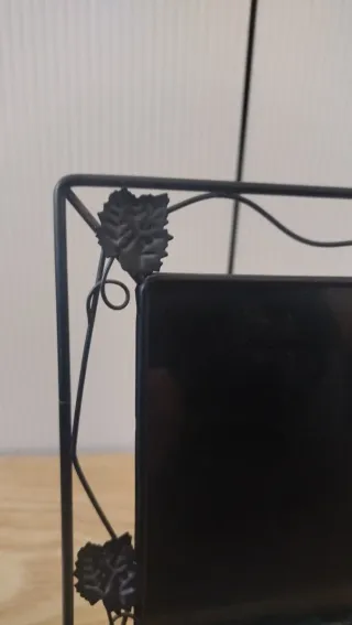 Portafoto in ferro nero con decorazioni