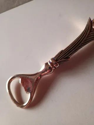 Abridor antiguo forma flor plateado