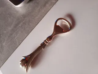 Abridor antiguo forma flor plateado