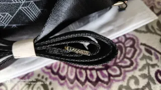 Bandolera de marca Lacoste Negra.