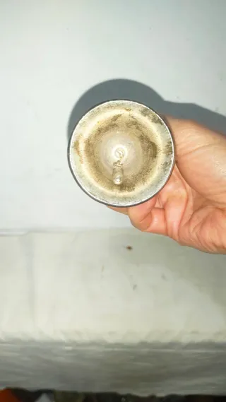 Campana peltre antigua niño espada repujada