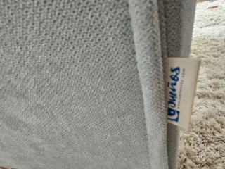 Sillón mecedora verde agua en tela y madera