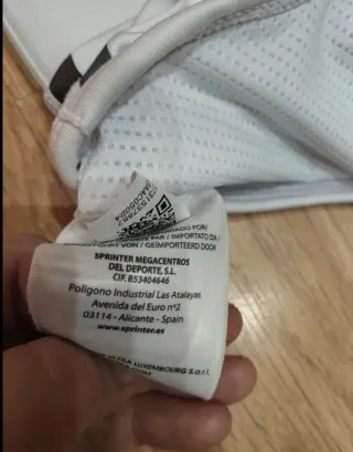 Top deportivo Fila blanco con triángulos