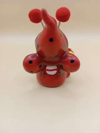 Soprammobile coccinella con fiore