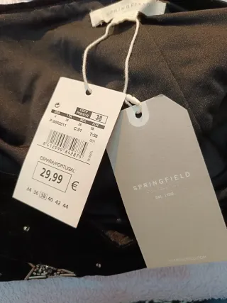 Falda mini negra con estrellas plateadas