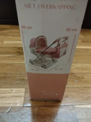 Carro de muñecas rosa con bolso