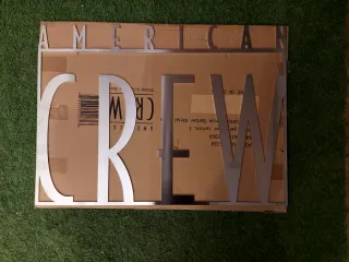 Cartel American Crew Acero Inoxidable