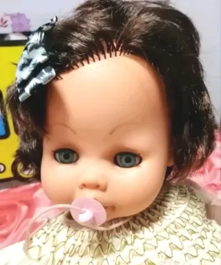 Muñeca antigua con chupete