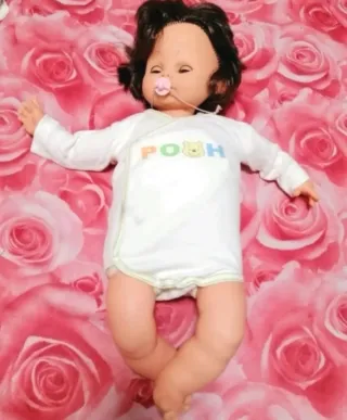 Muñeca antigua con chupete