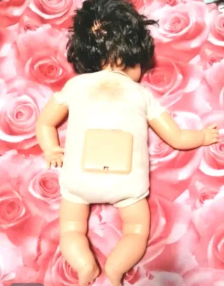 Muñeca antigua con chupete