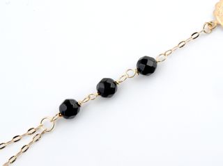 manita oro 18k con piedra con onix