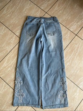 Jeans donna larghi con croci