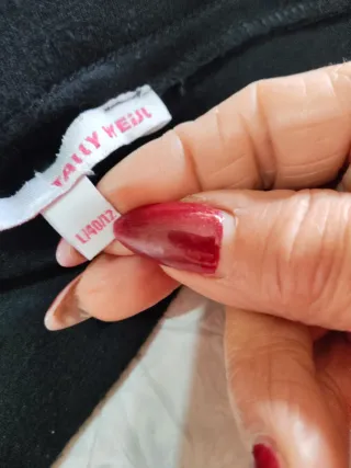 Top asimmetrico con paillettes