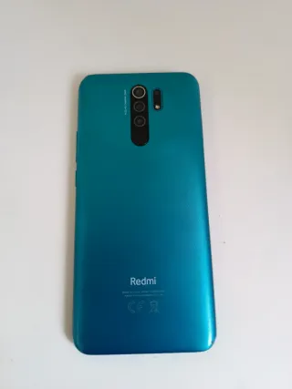 Xiaomi Redmi 9 con cargador y funda