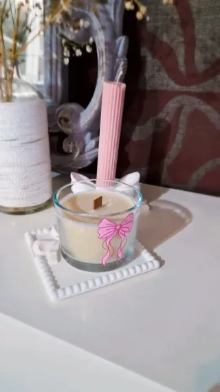 Vela aromática con lazo rosa