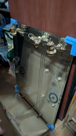 Espejo decorativo dorado y transparente