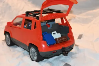 Coche familiar rojo Playmobil con figuras