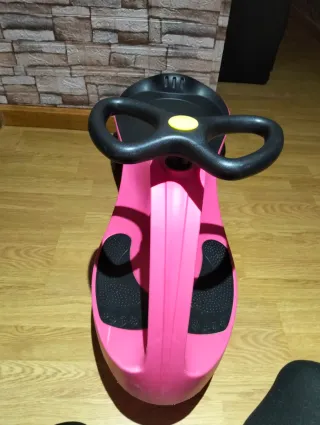 Patinete infantil rosa esta usado pero perfecto.