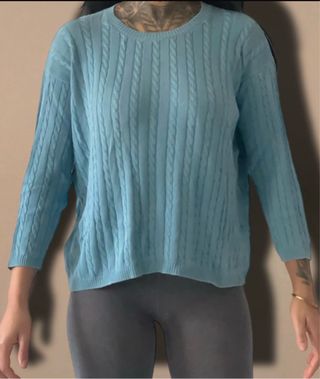 Maglione azzurro a trecce
