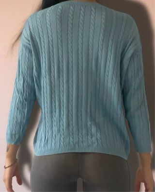 Maglione azzurro a trecce