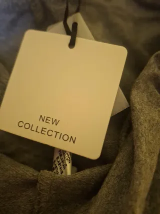 Pantaloni grigi con fiocco