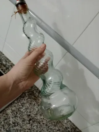 Botella de cristal decorativa