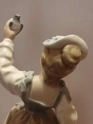 Figura Lladro porcelana niña con pájaro