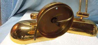 Coppia applique in metallo dorato