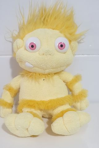 Muñeco peluche amarillo ojos grandes