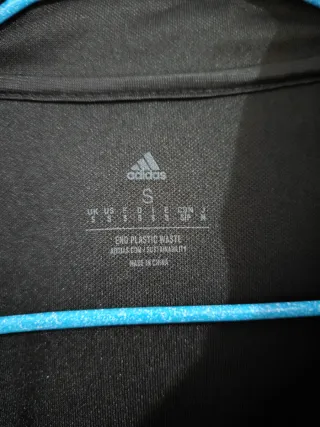 Chaqueta deportiva Adidas negra y naranja