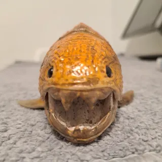 Figura pez prehistórico naranja