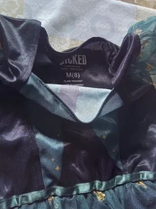 Vestido de fiesta con estrellas doradas7.8 años