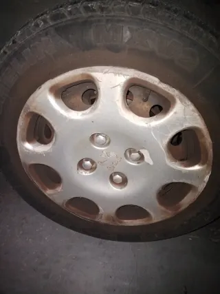 Cuatro Tapacubos Peugeot 206