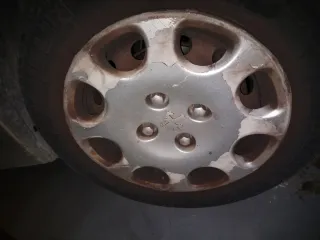 Cuatro Tapacubos Peugeot 206