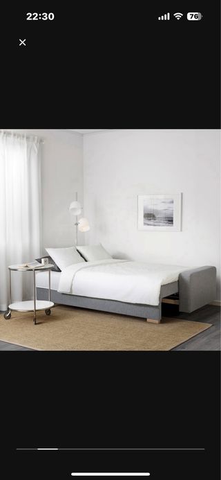 Sofá cama gris de tela