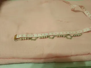 Pulsera de plata con bolitas y flor