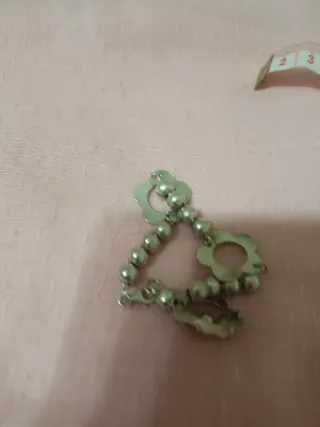 Pulsera de plata con bolitas y flor