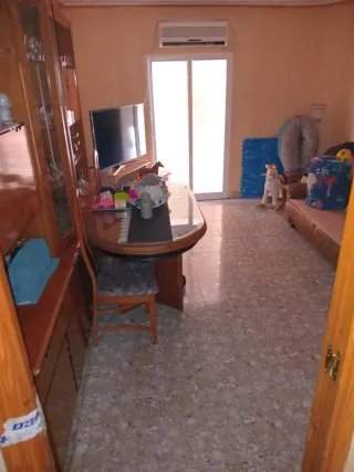 Mesa de comedor grande de madera y cristal