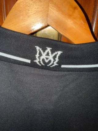Polo Amiri Negro con Logo Blanco