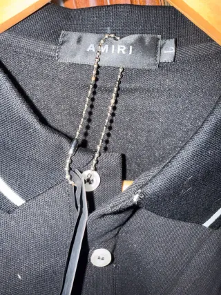 Polo Amiri Negro con Logo Blanco
